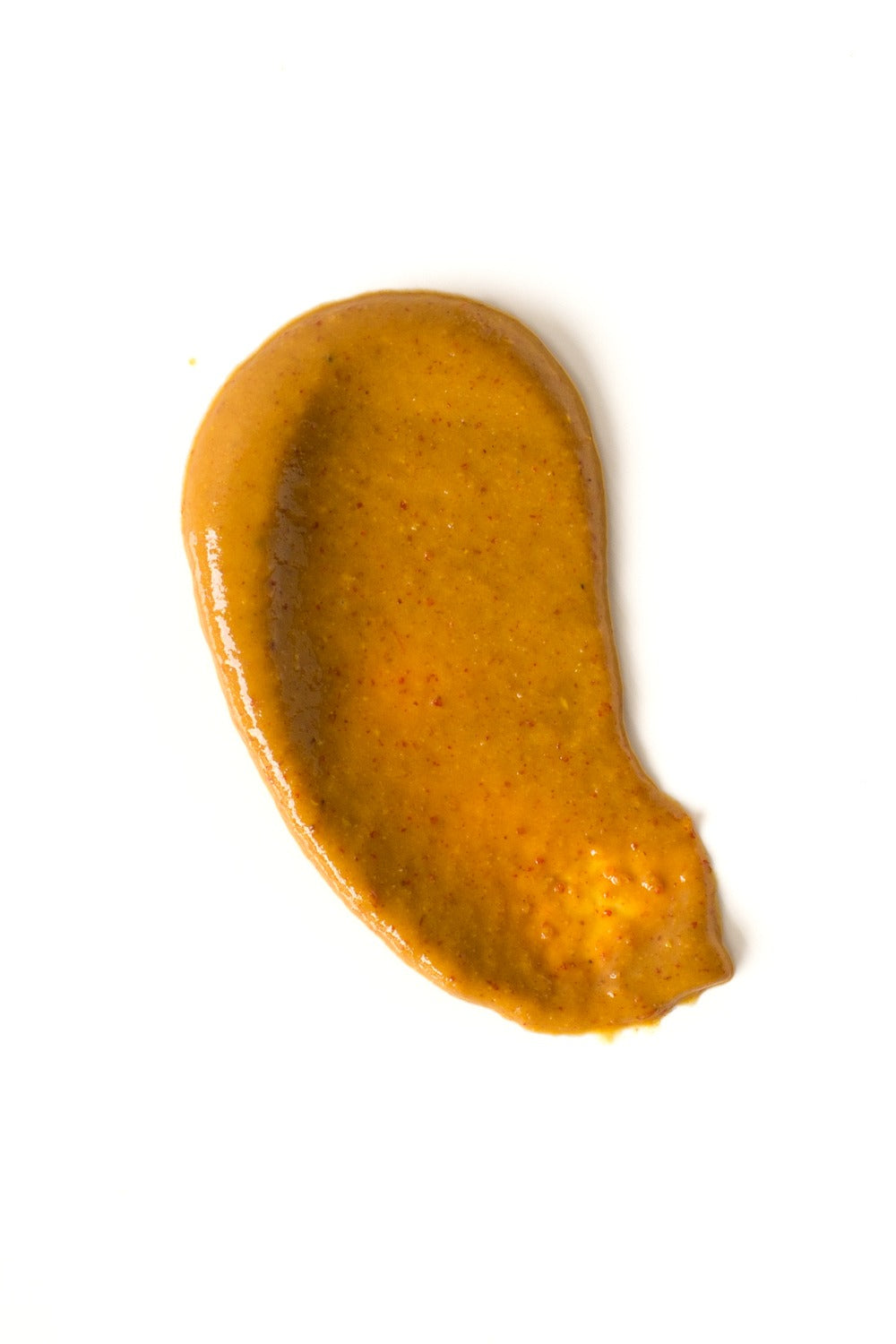 Orange-colored substance on a white background