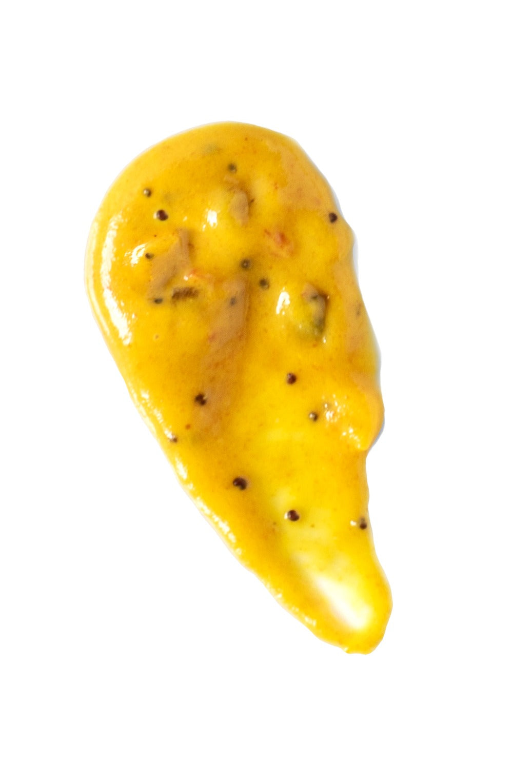 Yellow fruit with black seeds on a white background