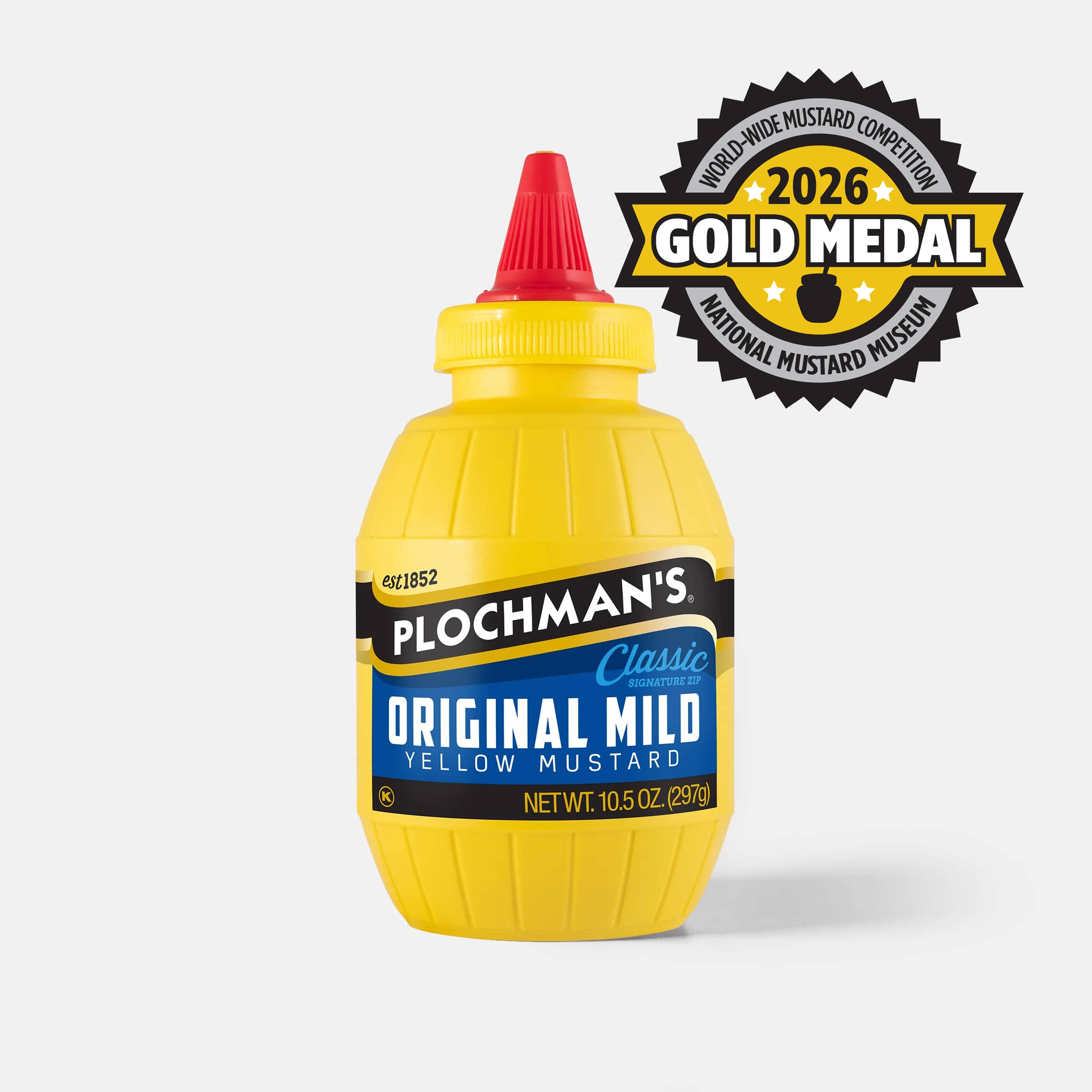 A bottle of Plochman's Classic Original Mild Yellow Mustard with a red cap, 2026 Gold Medal badge from the Worldwide Mustard Competition from the Mustard Museum.