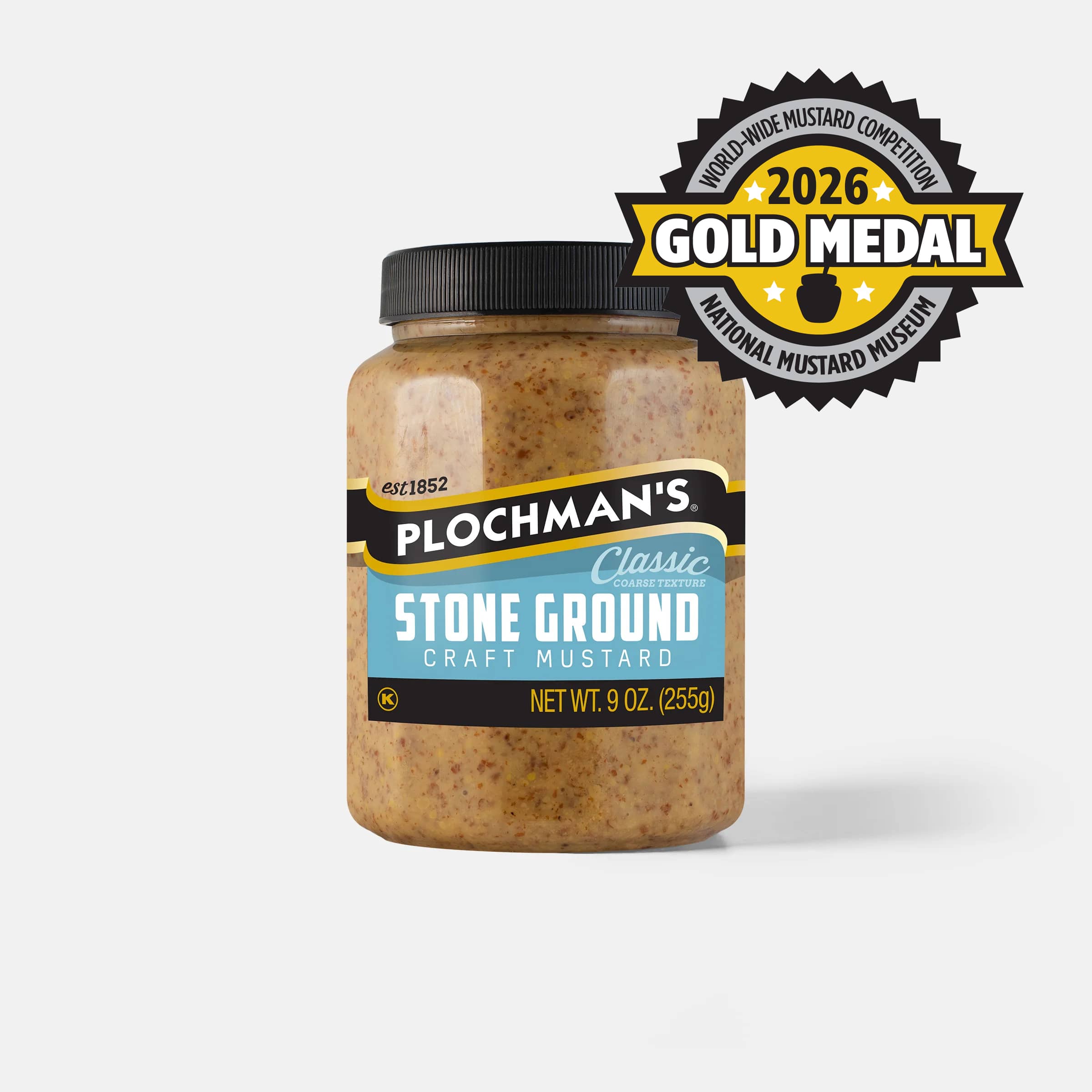 A jar of Plochman's Classic Stone Ground Craft Mustard with a black lid featuring a 2026 Gold Medal badge from the Worldwide Mustard Competition from the Mustard Museum.