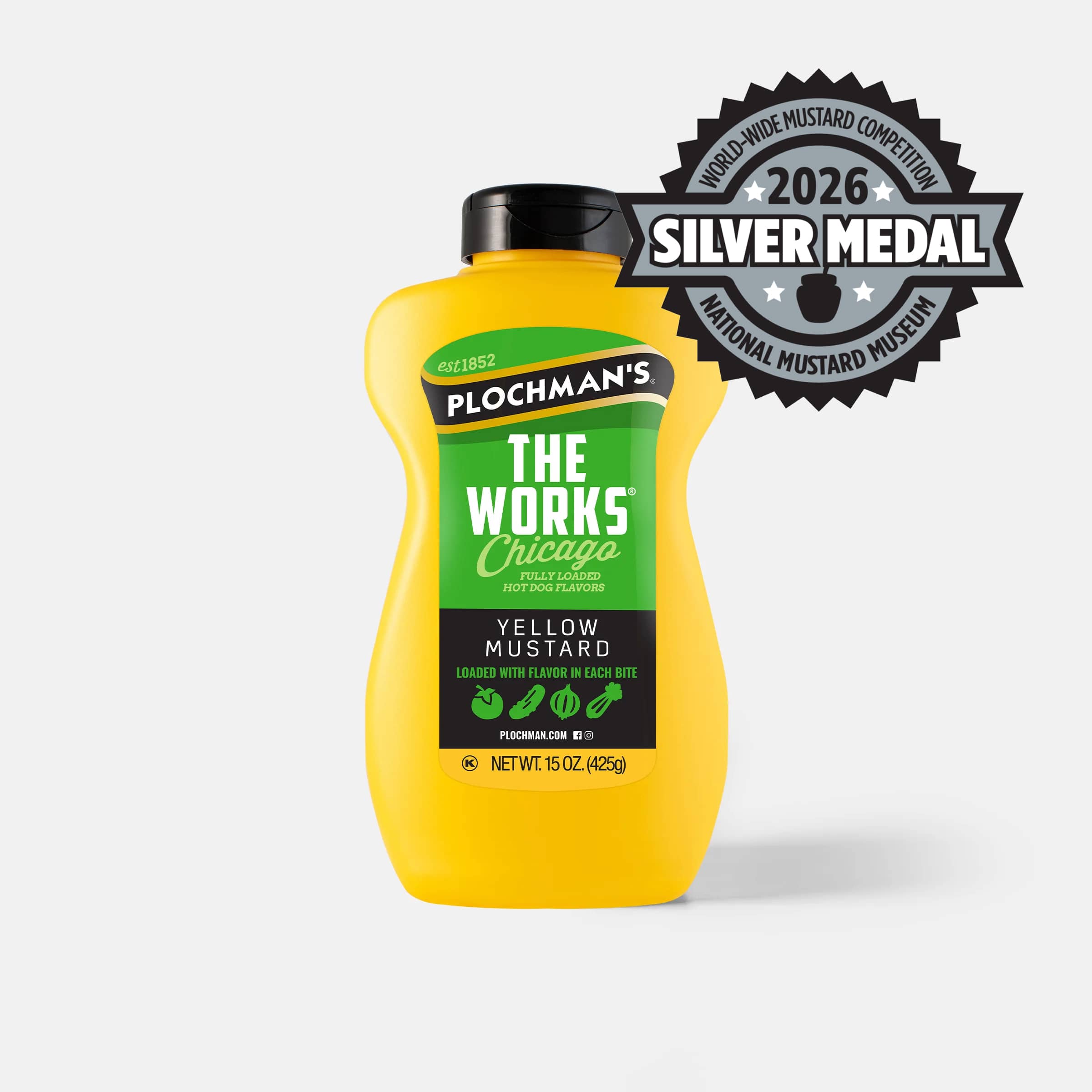A bottle of Plochman's The Works Chicago Yellow Mustard with a black cap, featuring a 2026 Silver Medal badge from the Worldwide Mustard Competition from the Mustard Museum.