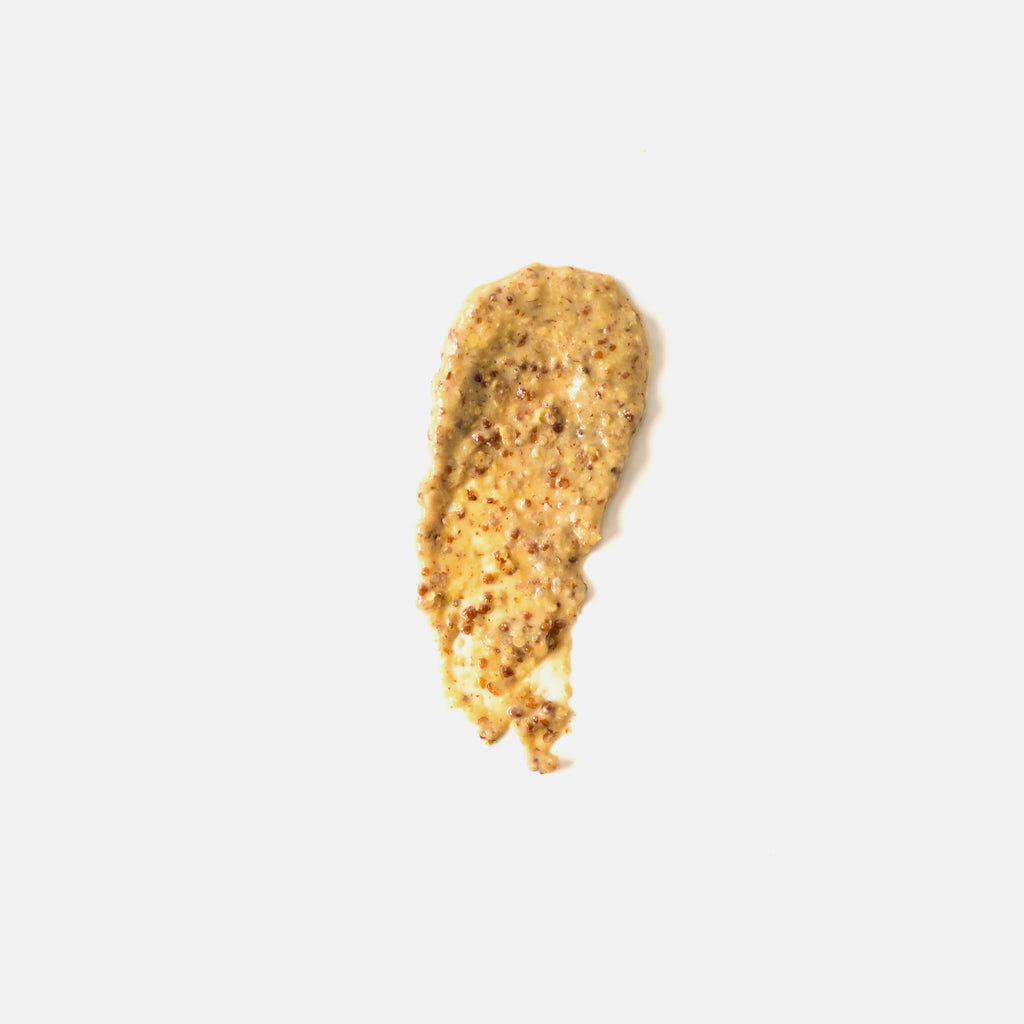 Close-up of a smear of brown mustard