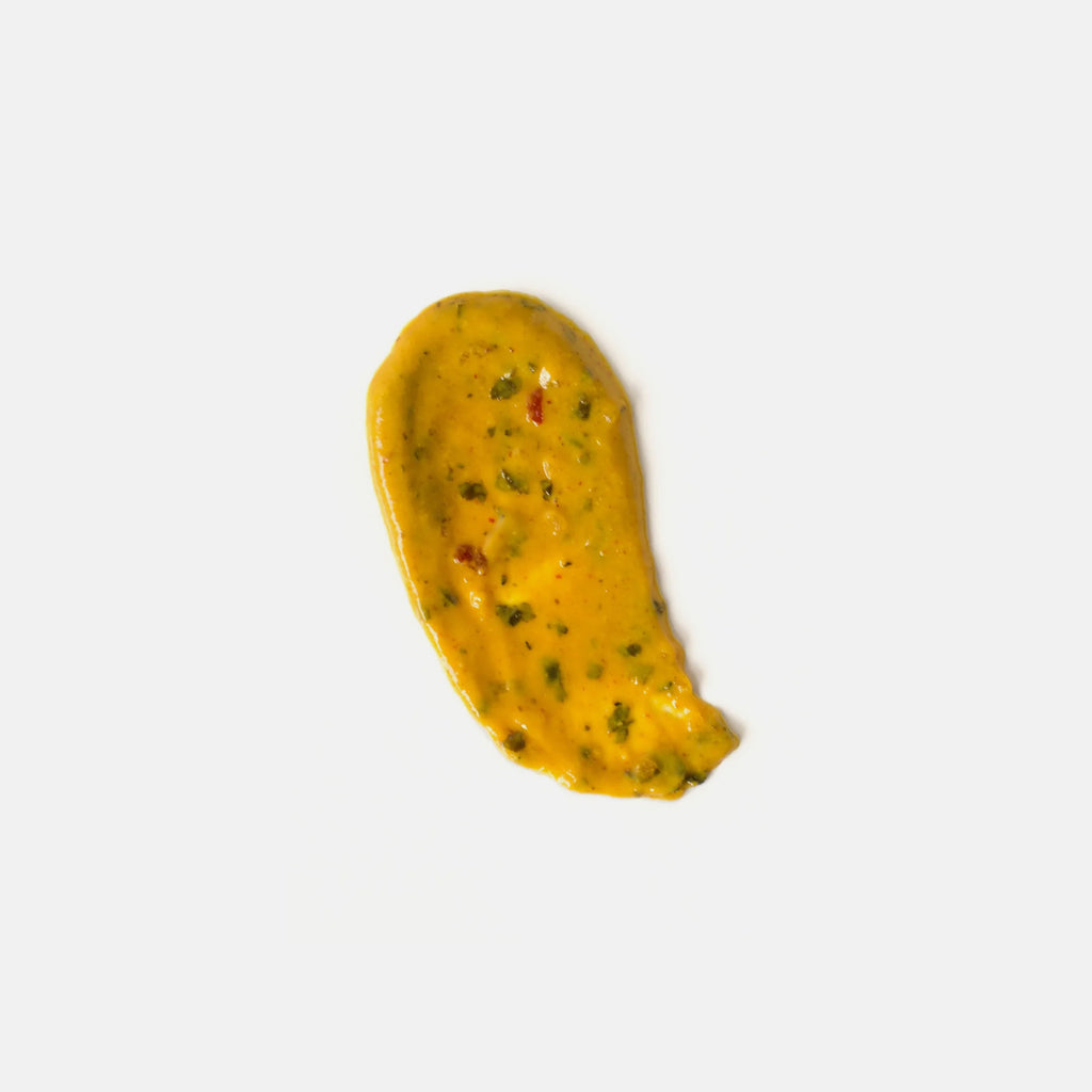 Yellow mustard smear with red and green herbs