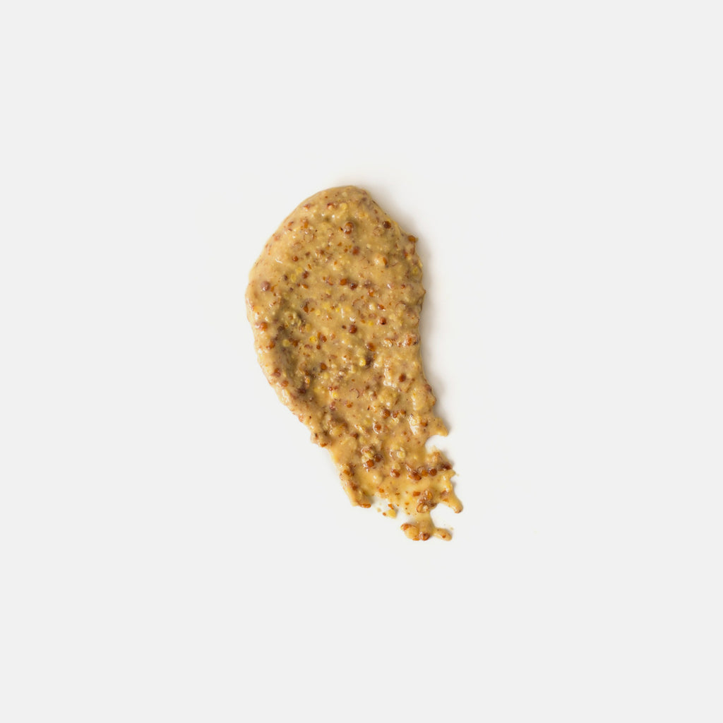 Smear of brown grainy mustard